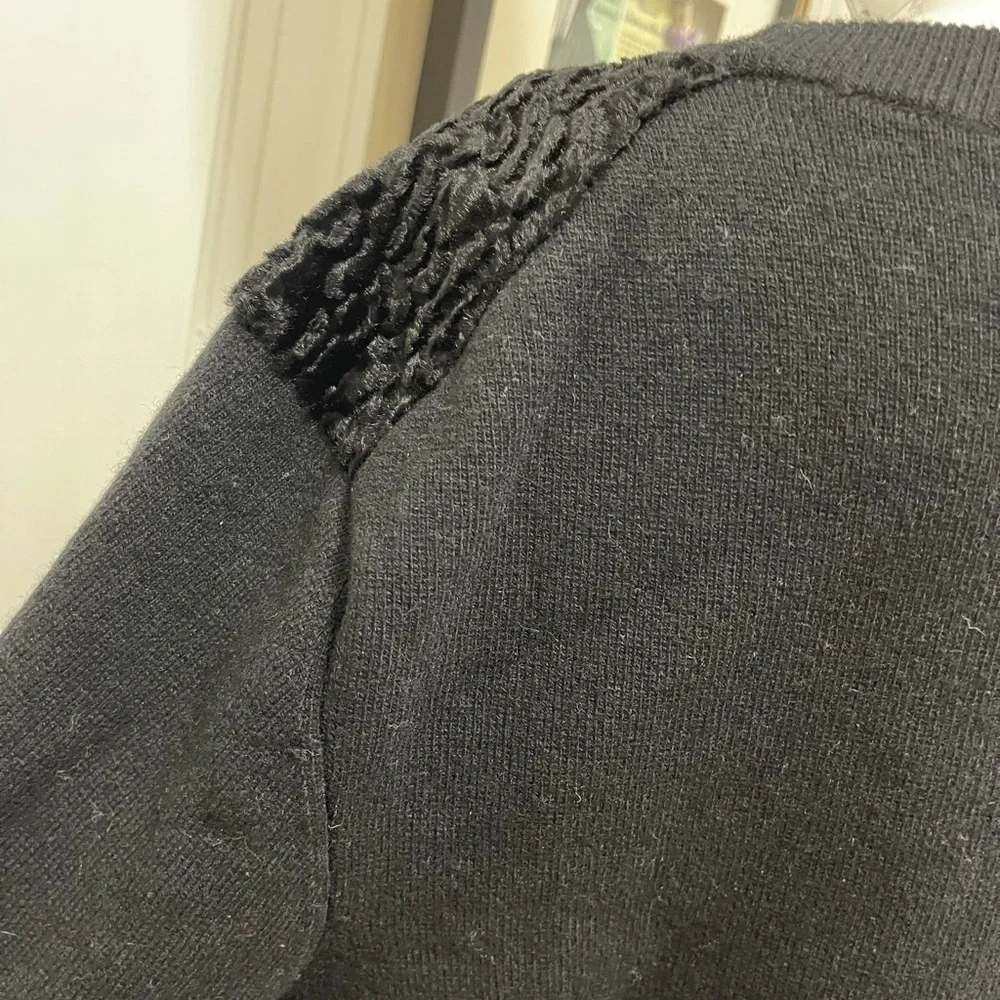 Kate spade black sweater. Looks like Front made with the unique sheep fur.